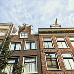 two Dutch canal houses with their signature gable facades