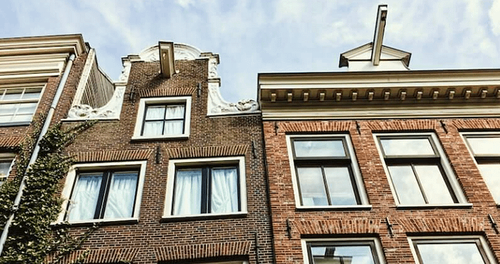 two Dutch canal houses with their signature gable facades