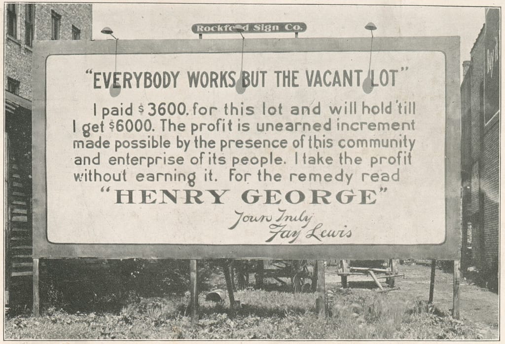Billboard on vacant urban land, which reads "everybody works but the vacant lot"